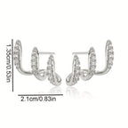 Elegantes pendientes de tres garras con pedrería