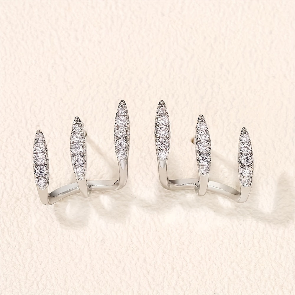 Elegantes pendientes de tres garras con pedrería