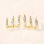 Elegantes pendientes de tres garras con pedrería