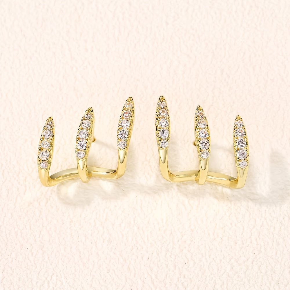 Elegantes pendientes de tres garras con pedrería